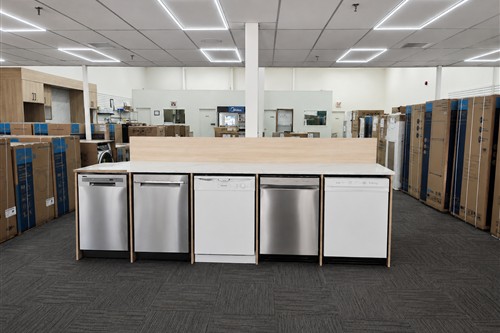 Dishwashers on display and boxed appliances in stock at the Appliance Kingdom Calgary showroom on 52nd Avenue NE